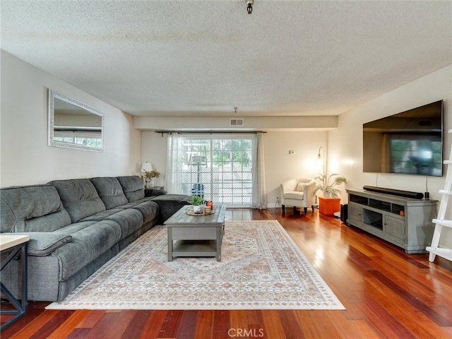 4142 E Mendez St Unit 331, Long Beach, CA 90815 - living area with a textured ceiling and wood finished floors