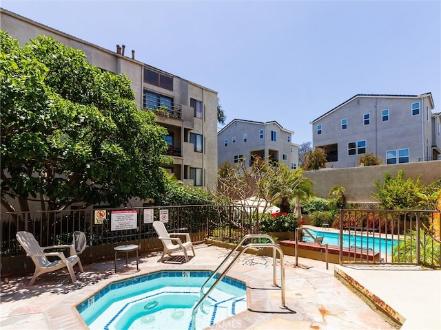 4142 E Mendez St Unit 331, Long Beach, CA 90815 - community pool featuring a hot tub, fence, and a patio area