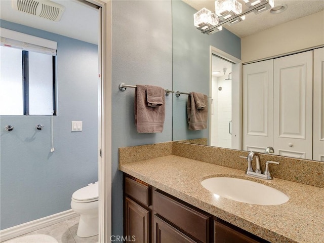 4142 E Mendez St Unit 331, Long Beach, CA 90815 - full bathroom featuring toilet, baseboards, vanity, tile patterned flooring, and a shower with shower door