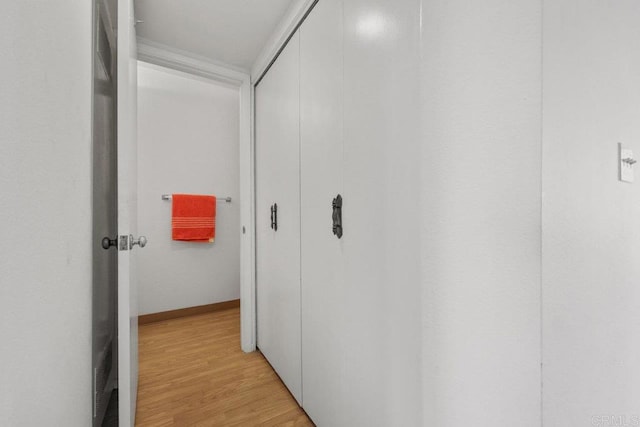 hallway with light wood-type flooring