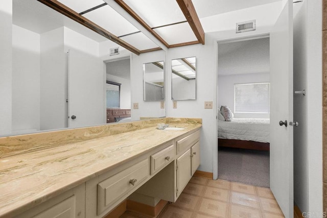 bathroom featuring connected bathroom, tile patterned floors, visible vents, and vanity