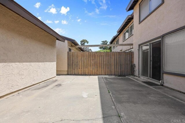 view of patio / terrace featuring fence