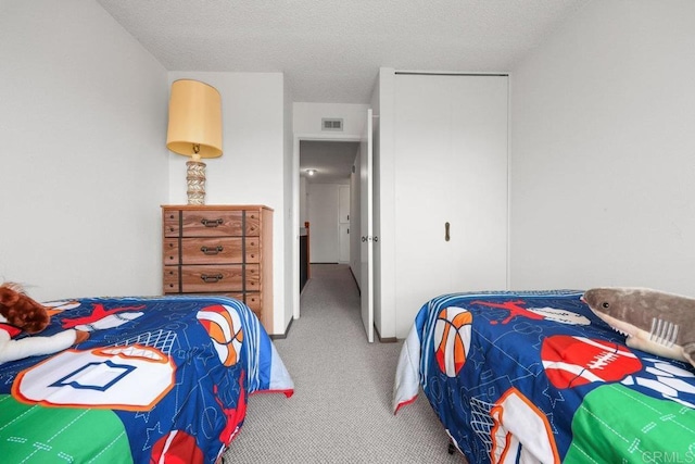 bedroom with visible vents and carpet
