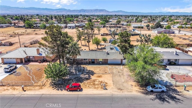 bird's eye view with a residential view and a mountain view