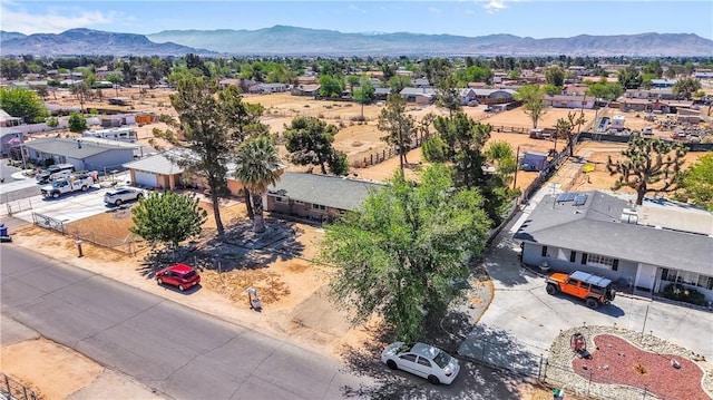 birds eye view of property featuring a mountain view