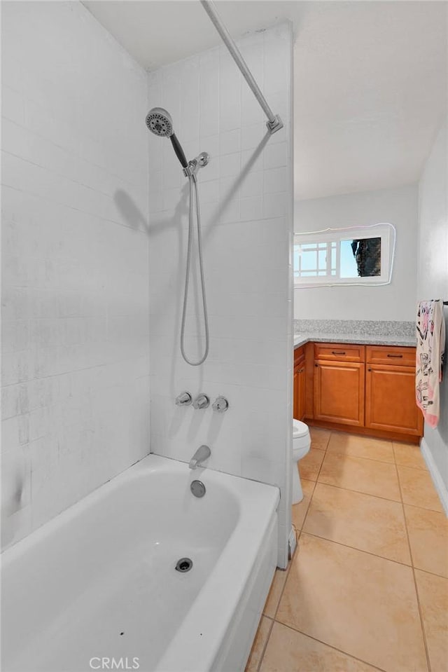 bathroom with bathing tub / shower combination, tile patterned flooring, vanity, and toilet