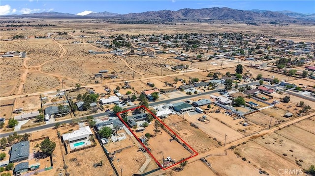 bird's eye view featuring view of desert and a mountain view