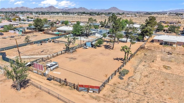 aerial view featuring view of desert, a mountain view, and a rural view