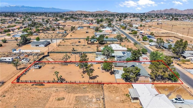 drone / aerial view featuring a mountain view and a residential view