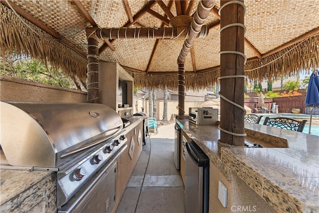 31768 Bottle Brush St, Winchester, CA 92596 - view of patio with grilling area, a fenced backyard, a fenced in pool, exterior kitchen, and a gazebo