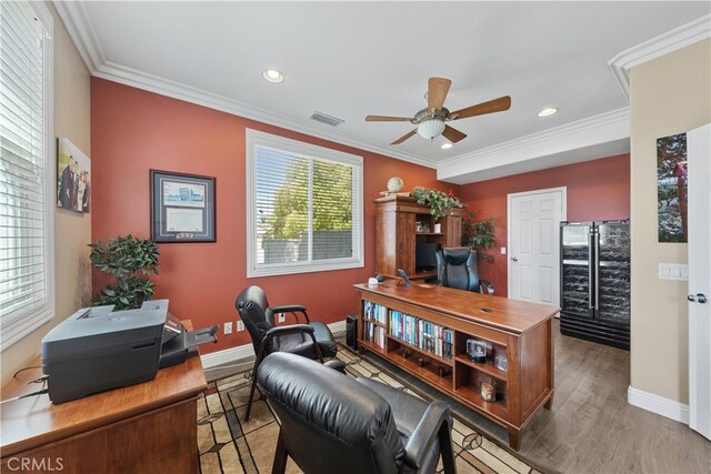 31768 Bottle Brush St, Winchester, CA 92596 - home office featuring crown molding, a ceiling fan, visible vents, and wood finished floors