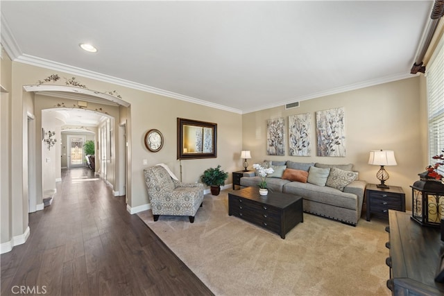 31768 Bottle Brush St, Winchester, CA 92596 - living room with crown molding, arched walkways, baseboards, and wood finished floors