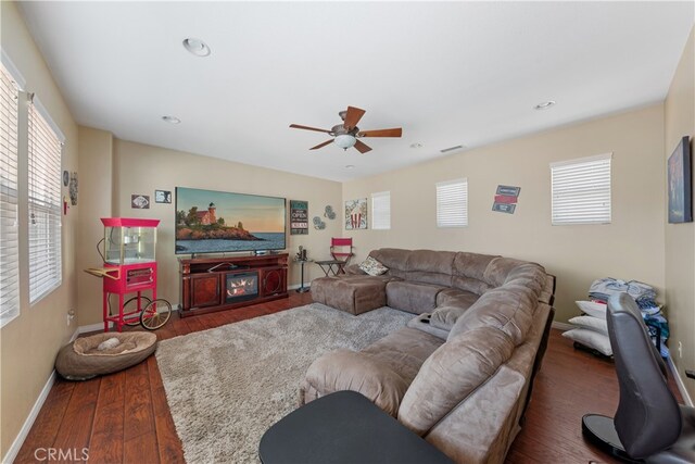 31768 Bottle Brush St, Winchester, CA 92596 - living area with plenty of natural light, baseboards, ceiling fan, and wood finished floors