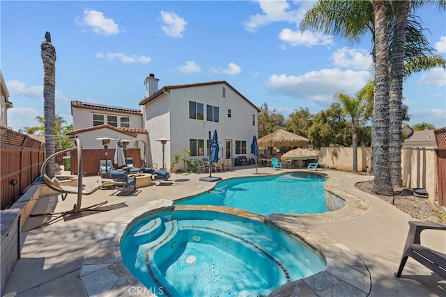 31768 Bottle Brush St, Winchester, CA 92596 - view of pool with a patio, a pool with connected hot tub, and a fenced backyard