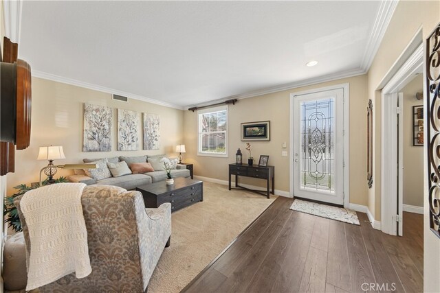 31768 Bottle Brush St, Winchester, CA 92596 - living room featuring crown molding, baseboards, dark wood-style floors, and visible vents