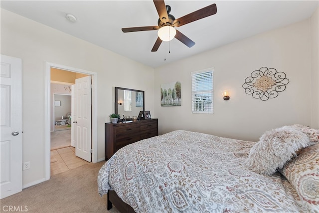 31768 Bottle Brush St, Winchester, CA 92596 - bedroom with light colored carpet, baseboards, ceiling fan, and light tile patterned floors