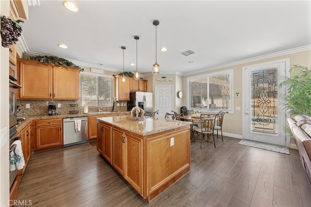 31768 Bottle Brush St, Winchester, CA 92596 - kitchen with visible vents, dark wood-type flooring, tasteful backsplash, a sink, and stainless steel appliances