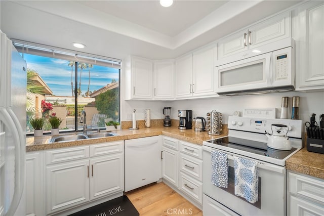 60 La Ronda Dr, Rancho Mirage, CA 92270 - kitchen with recessed lighting, a sink, white cabinets, and white appliances