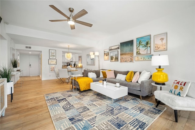 60 La Ronda Dr, Rancho Mirage, CA 92270 - living room featuring baseboards, ceiling fan, visible vents, and light wood-style flooring