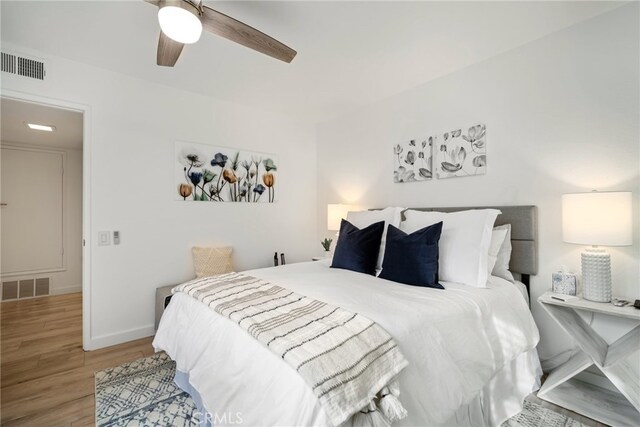 60 La Ronda Dr, Rancho Mirage, CA 92270 - bedroom featuring visible vents, baseboards, ceiling fan, and wood finished floors