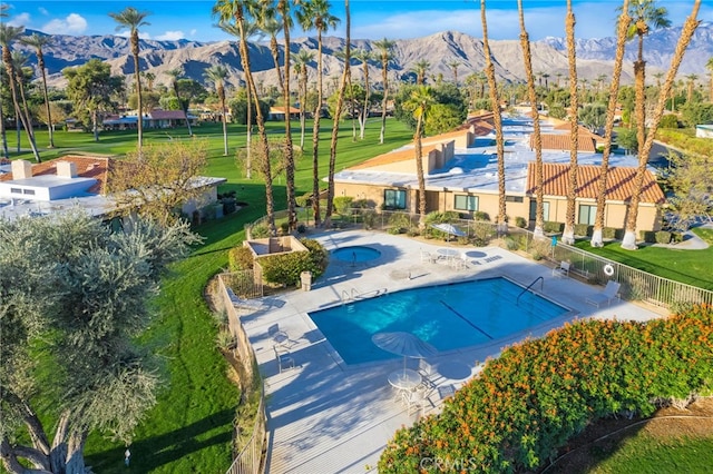60 La Ronda Dr, Rancho Mirage, CA 92270 - pool with fence, a mountain view, and a patio area