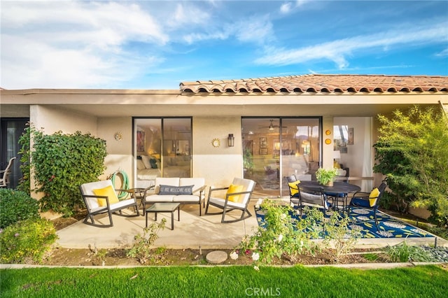 60 La Ronda Dr, Rancho Mirage, CA 92270 - back of house featuring an outdoor living space, a patio area, and stucco siding