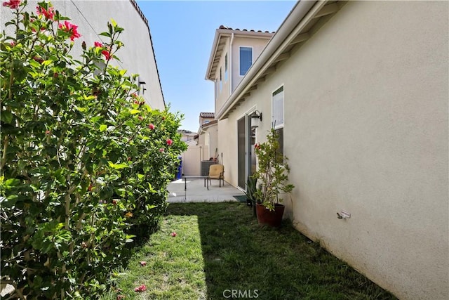 view of yard featuring fence and a patio