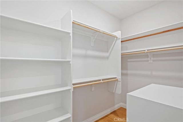 spacious closet with wood finished floors