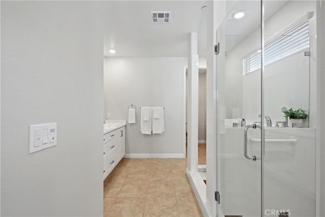 bathroom featuring visible vents, vanity, recessed lighting, tile patterned floors, and a stall shower