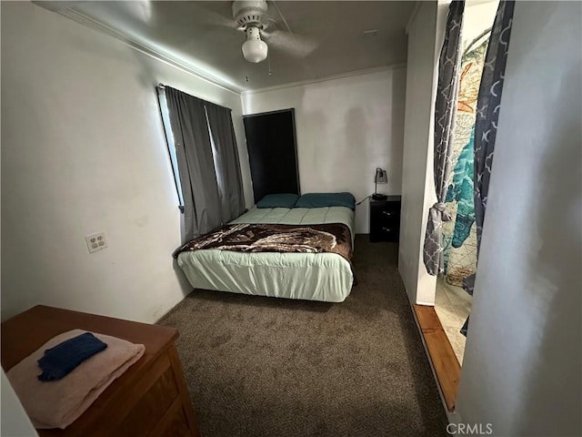 carpeted bedroom featuring a ceiling fan