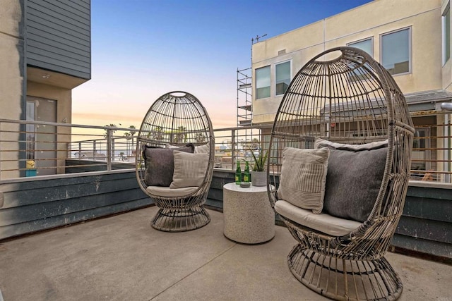 patio terrace at dusk with a balcony