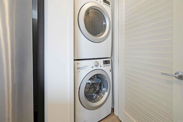 washroom featuring stacked washing maching and dryer and laundry area