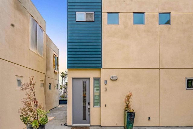 exterior space with stucco siding