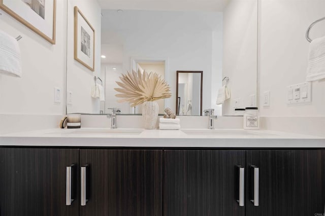 bathroom featuring double vanity and a sink