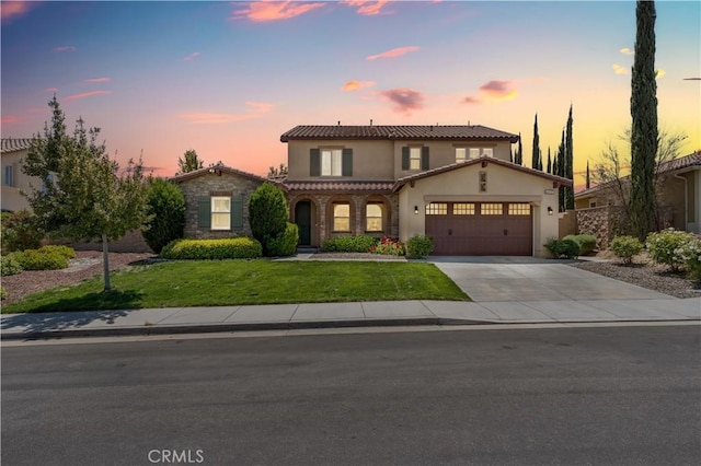 44557 Howell Mountain St, Temecula, CA 92592 - traditional-style house with a garage, a yard, concrete driveway, stone siding, and stucco siding