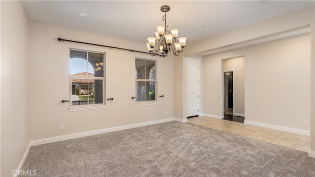 44557 Howell Mountain St, Temecula, CA 92592 - spare room with baseboards, a chandelier, tile patterned floors, and carpet