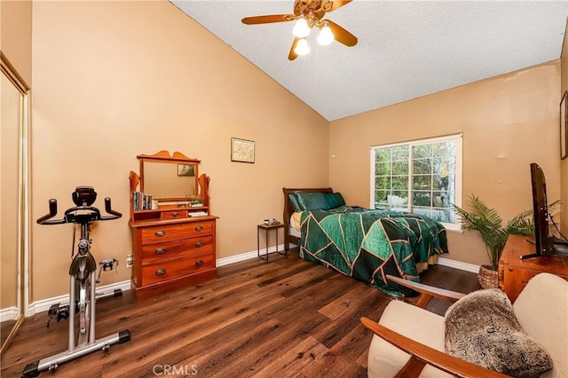 bedroom with baseboards, vaulted ceiling, and wood finished floors
