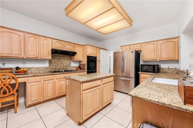 kitchen with under cabinet range hood, a sink, black appliances, and light brown cabinets