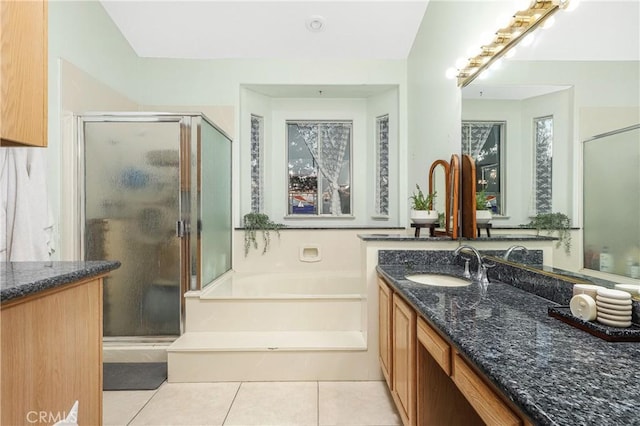 full bathroom with vanity, tile patterned flooring, a bath, and a stall shower
