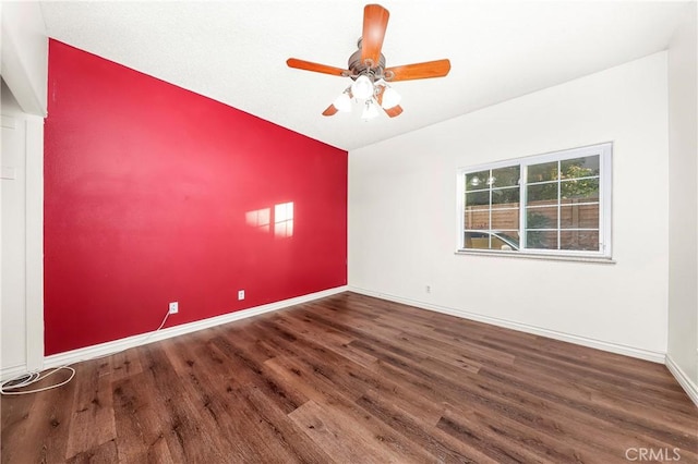 unfurnished room featuring baseboards, a ceiling fan, and wood finished floors