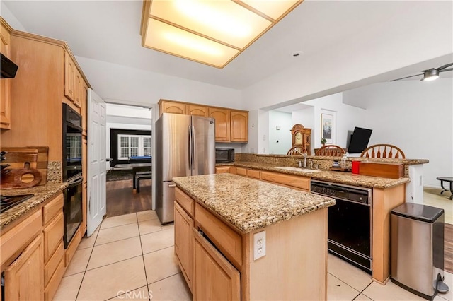 kitchen featuring a peninsula, a kitchen island, a sink, light tile patterned floors, and black appliances
