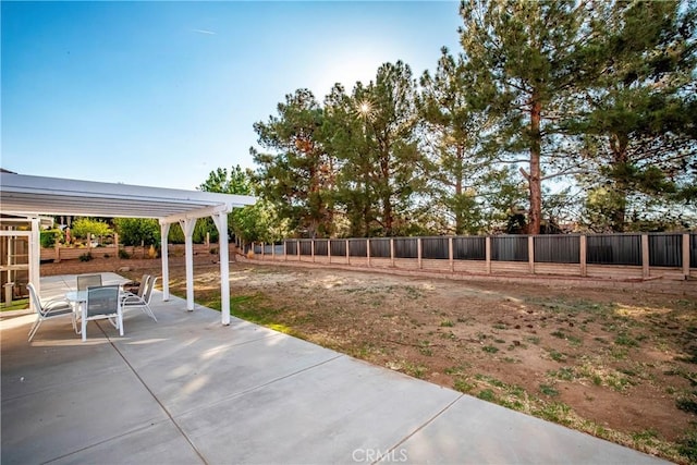 view of patio / terrace featuring a fenced backyard, outdoor dining space, and a pergola
