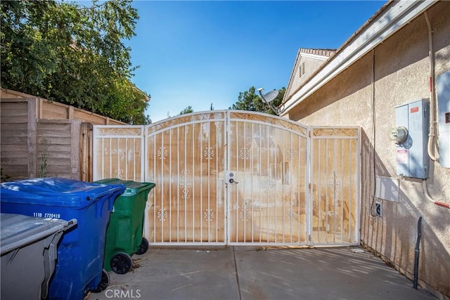 view of gate with fence