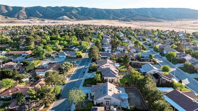 drone / aerial view featuring a residential view and a mountain view