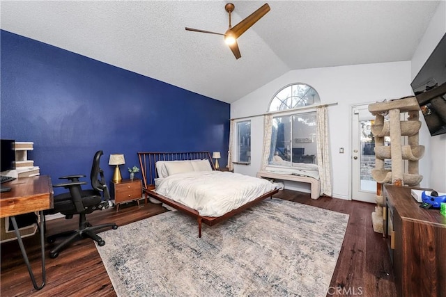 bedroom featuring access to outside, a textured ceiling, a ceiling fan, wood finished floors, and vaulted ceiling