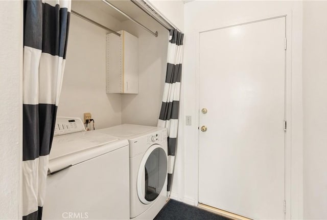 laundry area with washing machine and clothes dryer