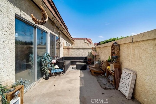 2129 El Domingo Cir Unit 19, Lancaster, CA 93536 - view of patio with fence and outdoor lounge area