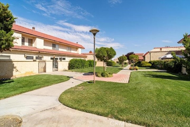 2129 El Domingo Cir Unit 19, Lancaster, CA 93536 - view of community featuring fence and a yard