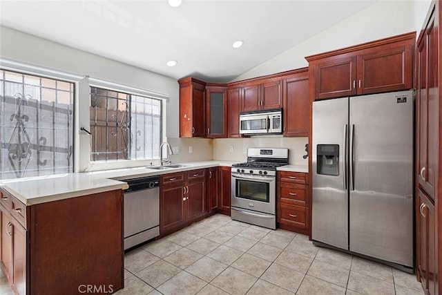 5461 Newcastle Ave Unit 14, Encino, CA 91316 - kitchen with light countertops, a sink, appliances with stainless steel finishes, light tile patterned floors, and vaulted ceiling
