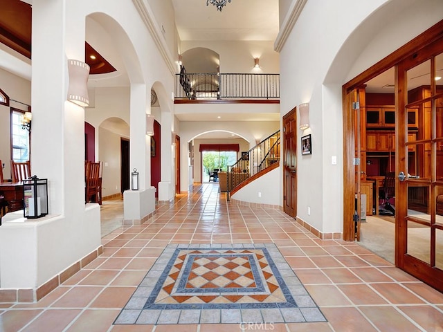 508 Lantern Crest Dr, Redlands, CA 92373 - tiled foyer with baseboards, arched walkways, and a towering ceiling